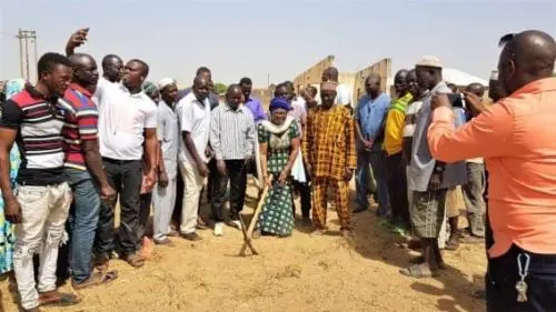 Bawku- Development Bawku MCE Hajia Ninchemah middle holding the pick axe to cut the sod