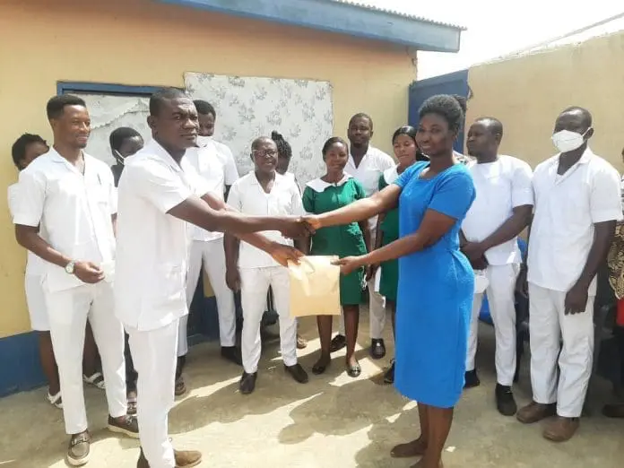 Madam Alice Akurigo (right) receiving cash donation from Mr Dickson Baba Nsoh, Nurses and Midwives Manager of the Bongo District Hospital Madam Alice Akurigo (right) receiving cash donation from Mr Dickson Baba Nsoh, Nurses and Midwives Manager of the Bongo District Hospital